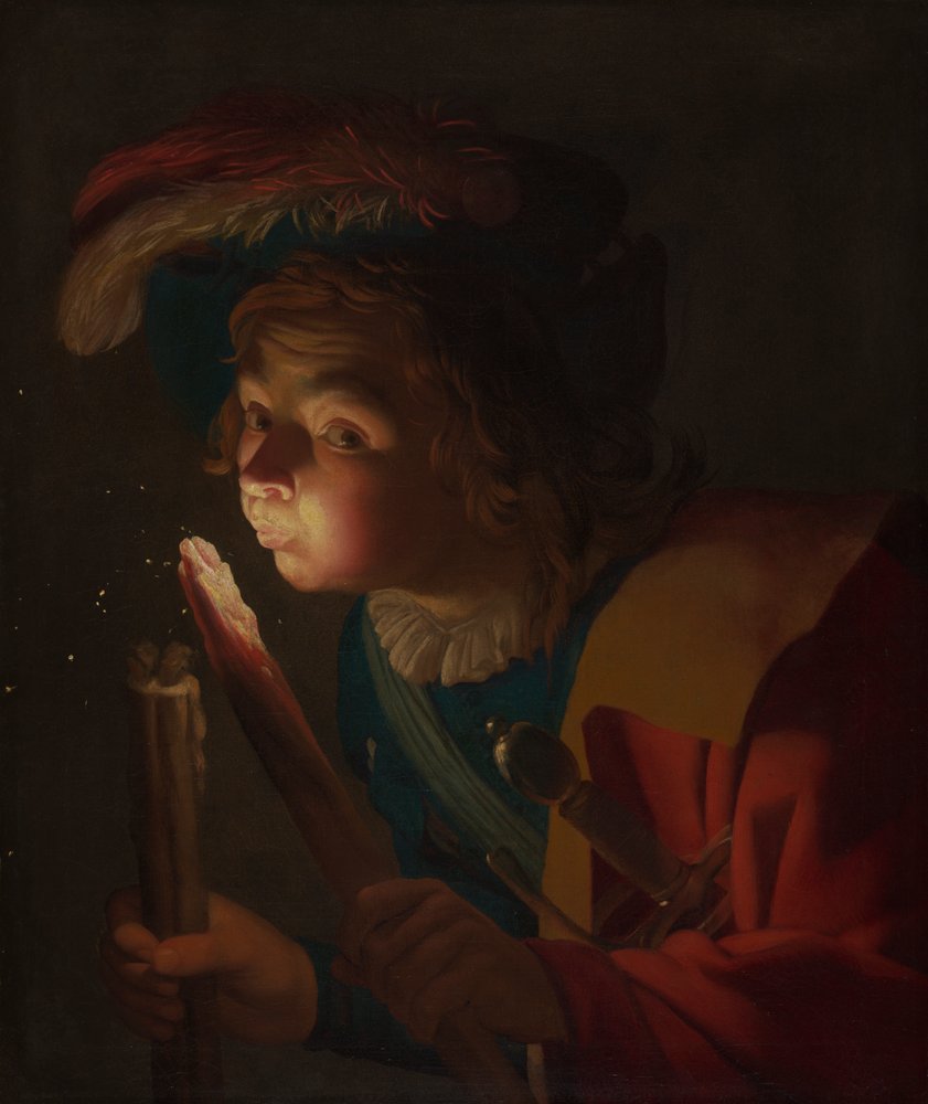 En gutt som blåser på en brann av Gerrit van Honthorst