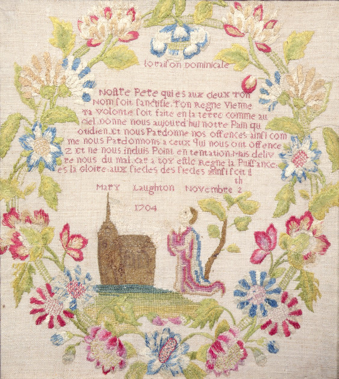 Prøvetaker med Lords Prayer på fransk over en knelende figur, utført av Mary Laughton, 1704 (silkearbeid) Mary Laughton, 1704 av Unknown