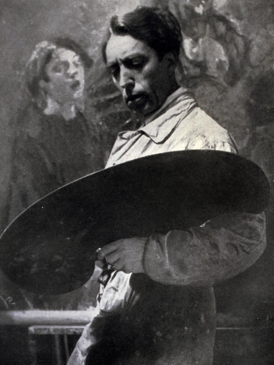 Portrett av maleren Tullio Silvestri på jobb i atelieret hans. Kunstneren poserer og ser på paletten hans som han holder, noe som antyder intensiteten til det kreative øyeblikket i prosessen (s/hvitt-bilde) av Alberto Segre