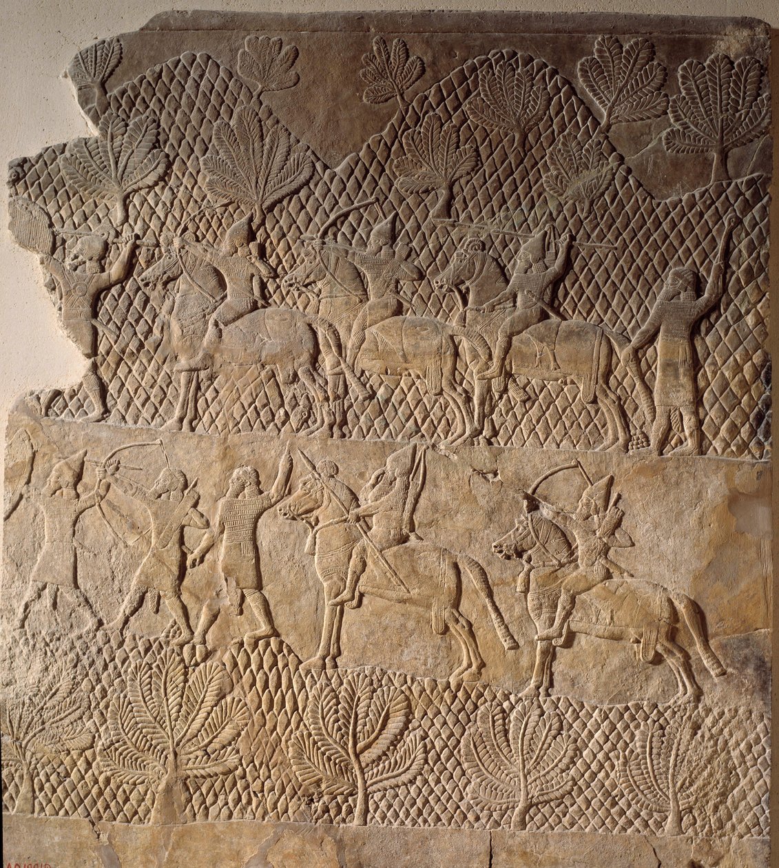 Orientalsk kunst fra antikken: kampscene. Lavt relieff av Assurbanipal-palasset, Assyria (7. århundre f.Kr.). Paris, Louvre-museet av Assyrian
