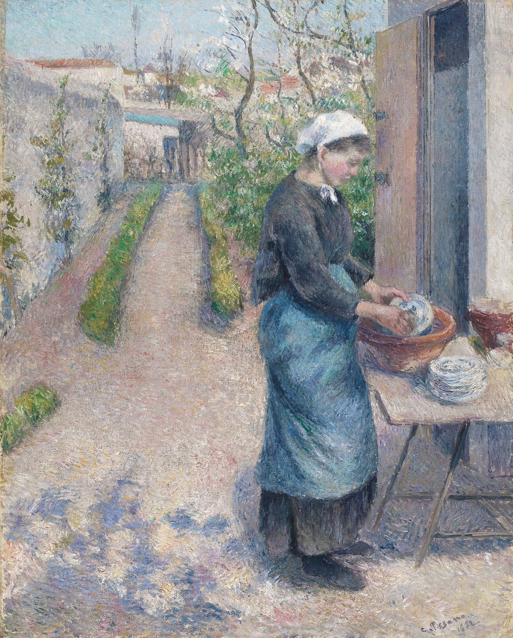 In the Garden at Pontoise: A Young Woman Washing Dishes, 1882 av Camille Jacob Pissarro