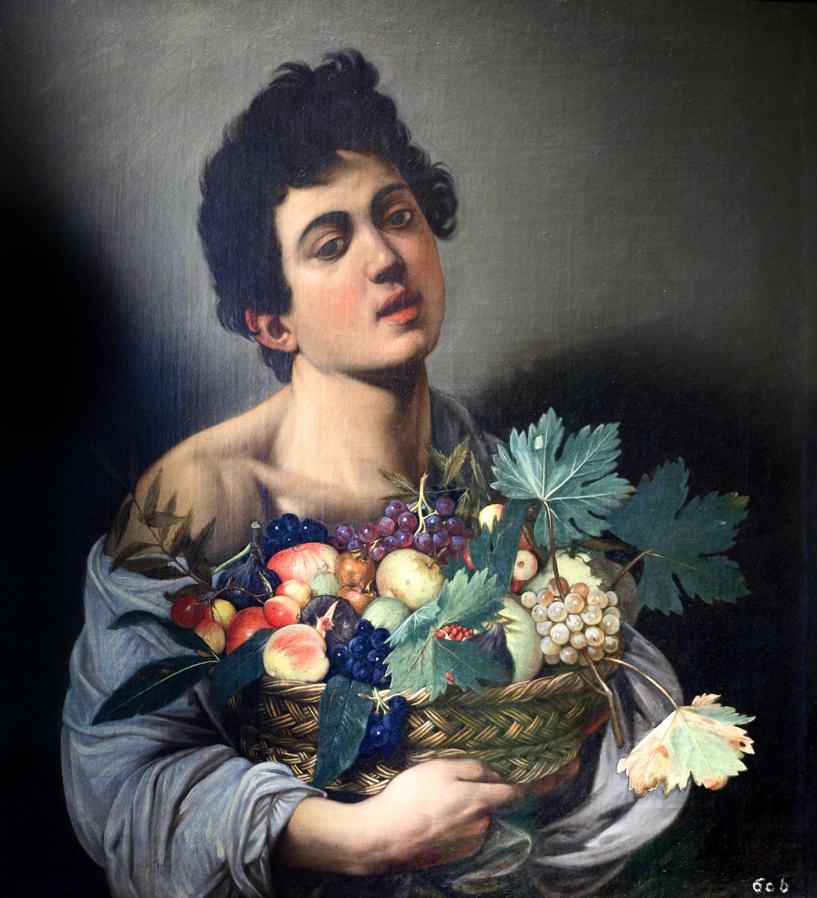 Gutt med fruktkurv av Caravaggio av Michelangelo Merisi Caravaggio