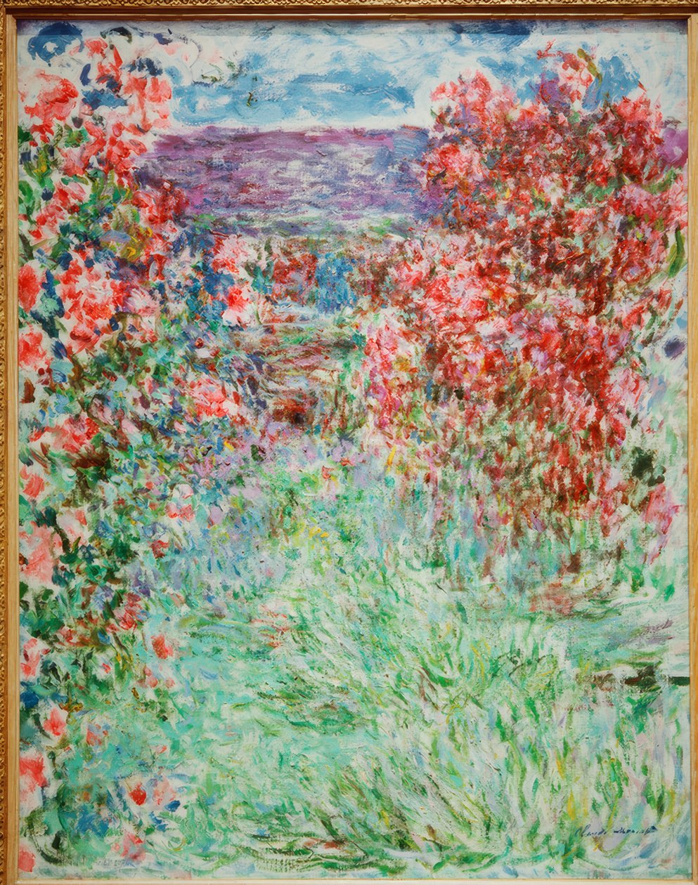 Huset blant rosene av Claude Monet