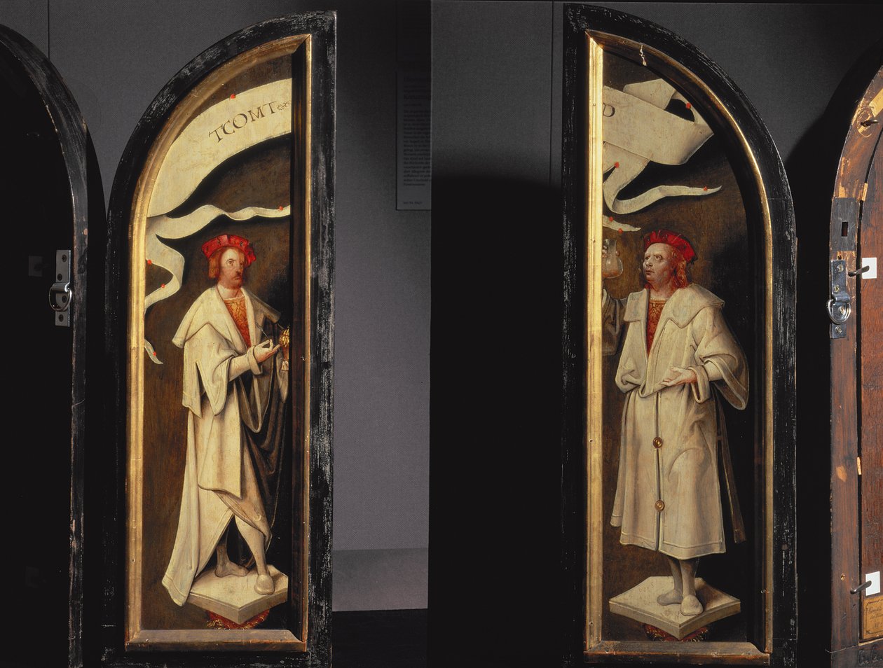 The Cleansing of Naaman Triptych: sidepaneler som viser martyrene Cosmas og Damian, beskyttere mot sykdom, 1520 (panel) av Cornelis Engebrechtsz