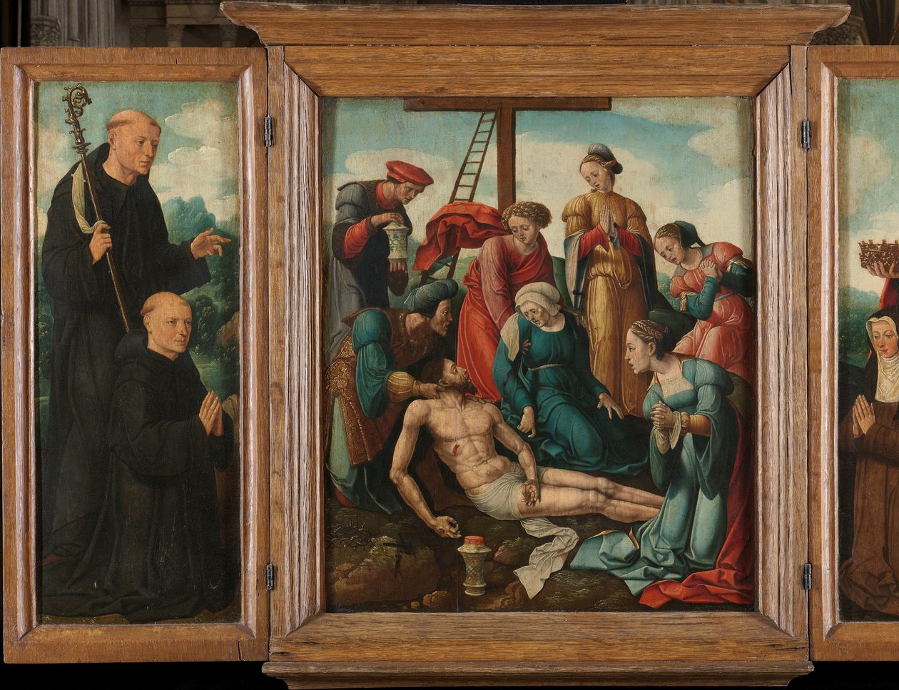 Triptych with the Lamentation of Christ (i midten), flankert av den mannlige giveren med Saint Benedict (venstre, indre fløy) og kvinnelig giver med Saint Elizabeth of Thuringia (høyre, indre fløy) av Cornelis Cornelisz II Buys (attributed to)