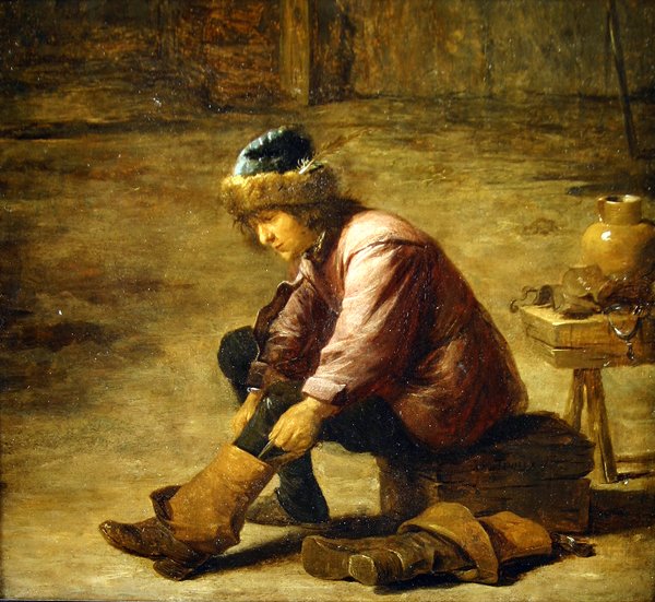 En ung mann som drar på seg en støvel av David Teniers the Younger