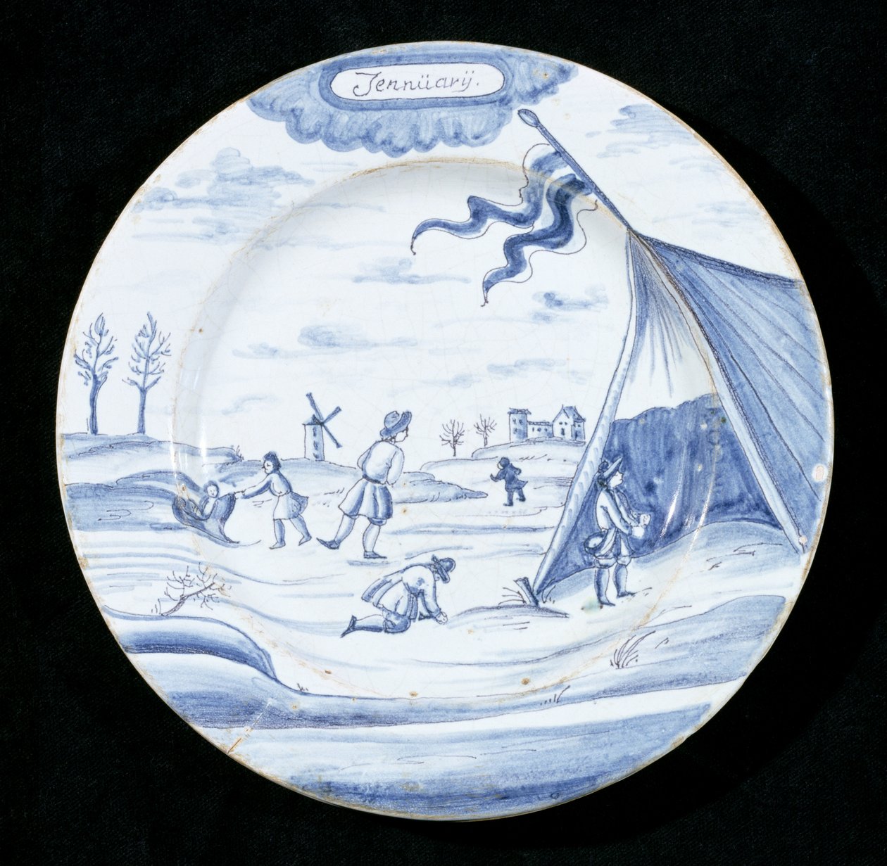 Delftvareplate som viser januar måned (tinnglasert lertøy) av Dutch School