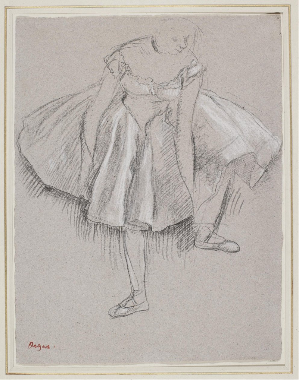 Danser som justerte tøffelen av Edgar Degas