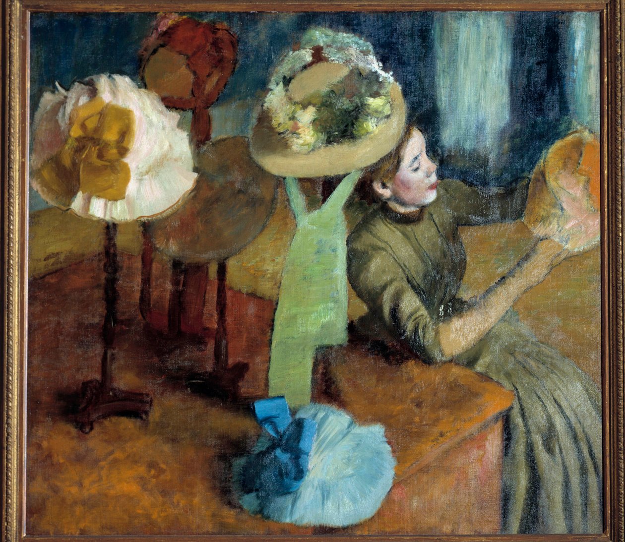 Hos mølleren (eller The Millinery Shop) av Edgar Degas