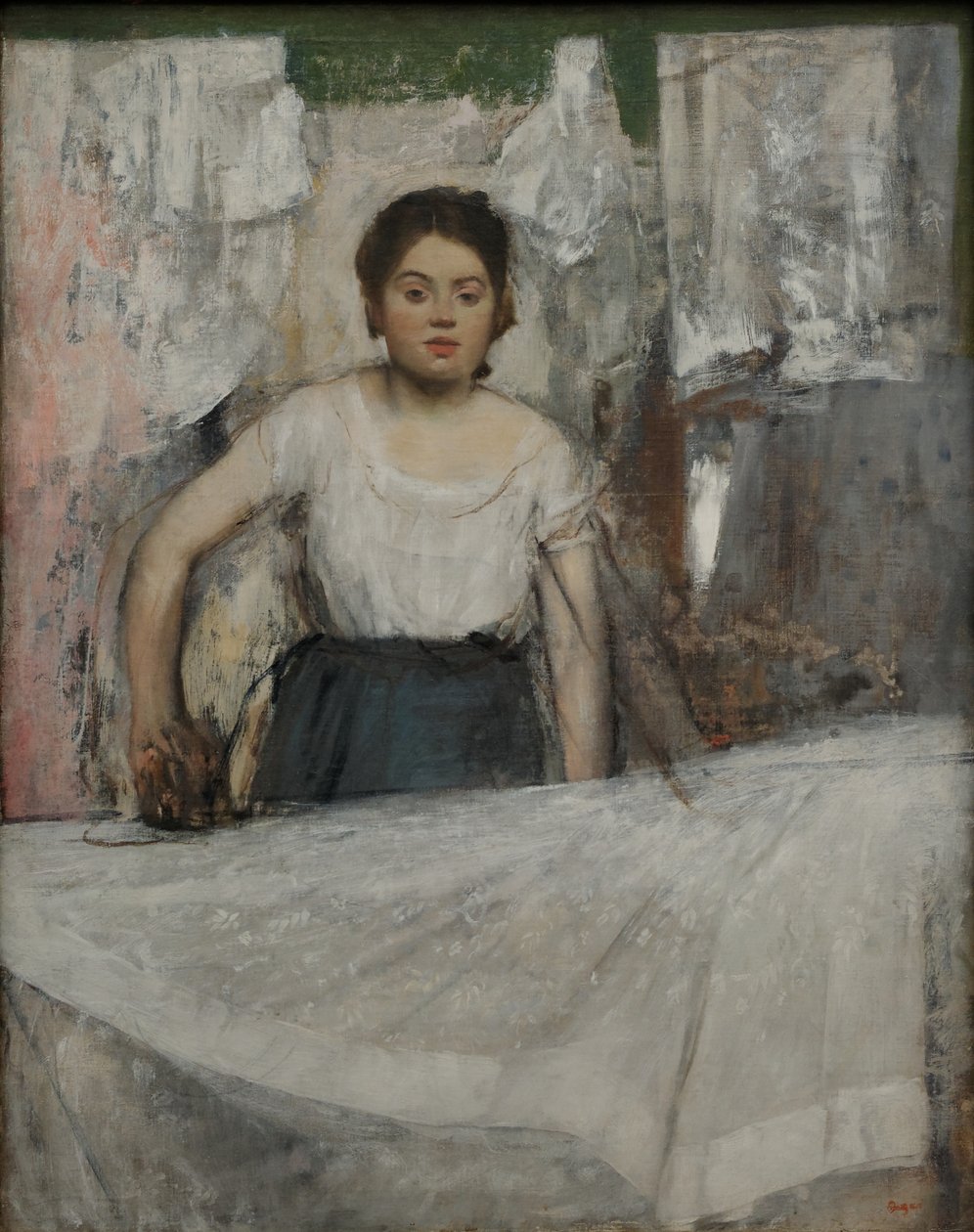 Kvinne som stryker av Edgar Degas