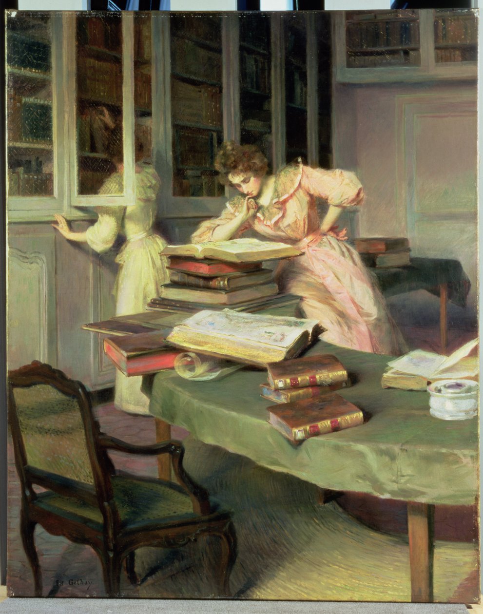 Elegante kvinner i et bibliotek av Edouard Gelhay