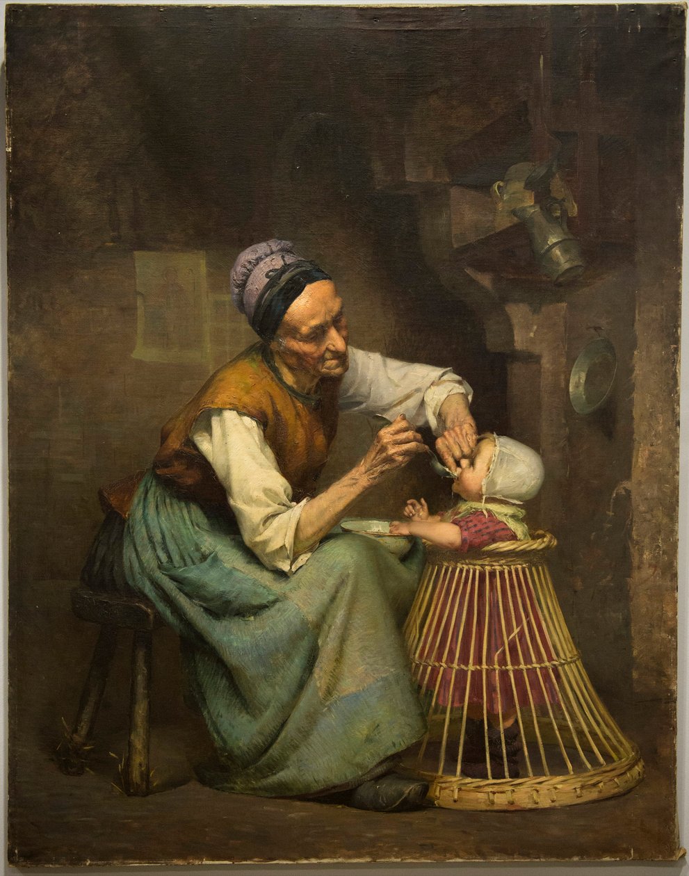 En gammel kvinne mater barnebarnet sitt holdt i en flettet barnerullator, av Edouard Jerome Paupion av Edouard Jerome Paupion