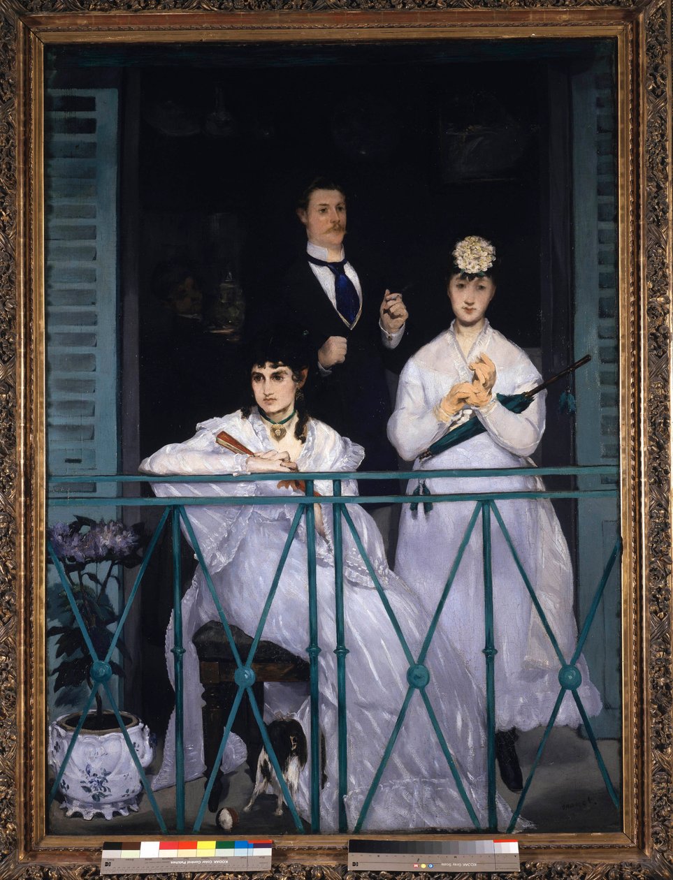 Balkong To unge kvinner som holder en vifte og en paraply og en mann med slips. Portrett av Berthe Morisot (1841-1895), fransk maler, Fanny Claus (1846-1877), fiolinist, Antoine Guillemet (1841-1918) landskapsarkitekt og bakgrunn Leon Leenhoff. Maleri av E av Édouard Manet