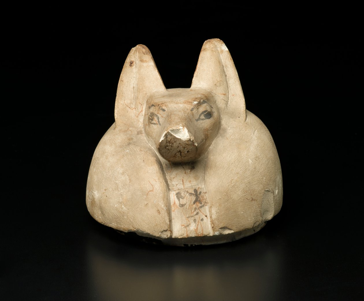Sjakalhodet deksel av en baldakinkrukke (kalkstein) av Egyptian