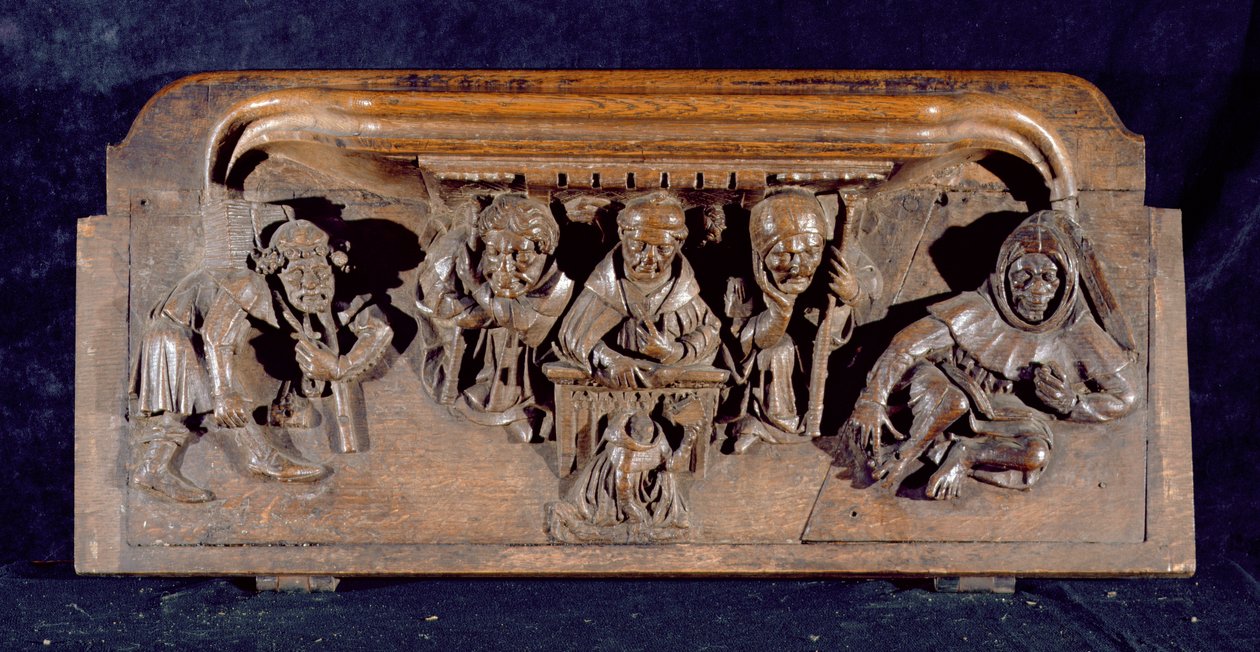 En misericord som skildrer en akademiker som sitter ved en panelpult og leverer en formaning til en knelende angrende, New College Chapel, Oxford, sent på 1300-tallet (tre) av English School