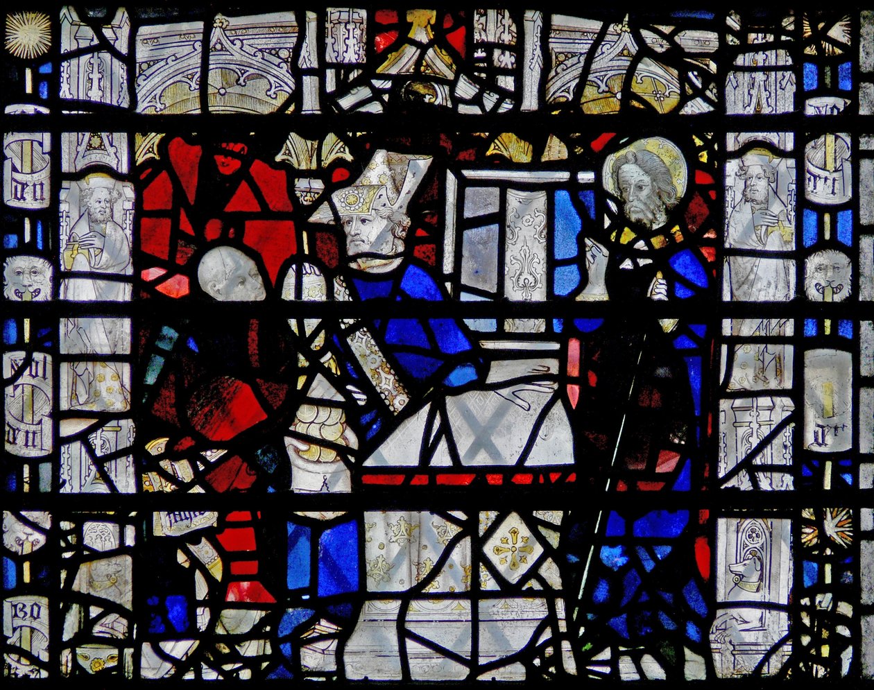 Vindu w6 som viser en scene fra St Nicholas liv; kant med figurer av English School