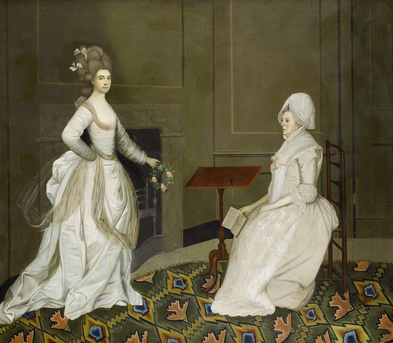To damer i et interiør, den ene leser, den andre holder en blomsterkrans av English School, 18th Century