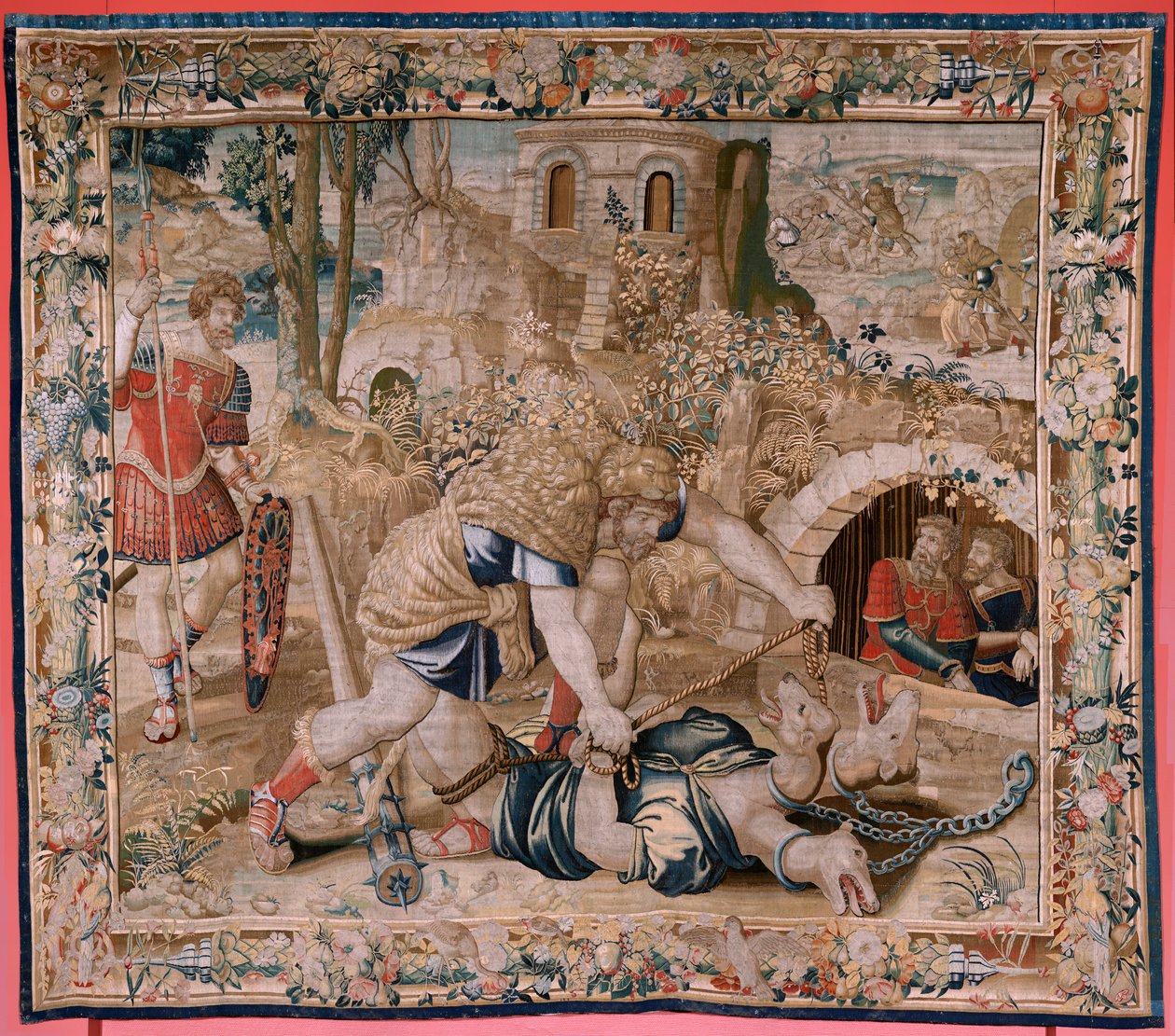 flamsk billedvev. Serien The Labors of Hercules. Hercules fanger Cerberus (Hércules captura a Cancerbero). Sjette billedvev i den eksisterende serien. Ukjent modell. Produksjon Willem Dermoyen, Brussel. Ca1528. Stoff Silke og ull. Størrelse 345 x 390 cm. L av Flemish School