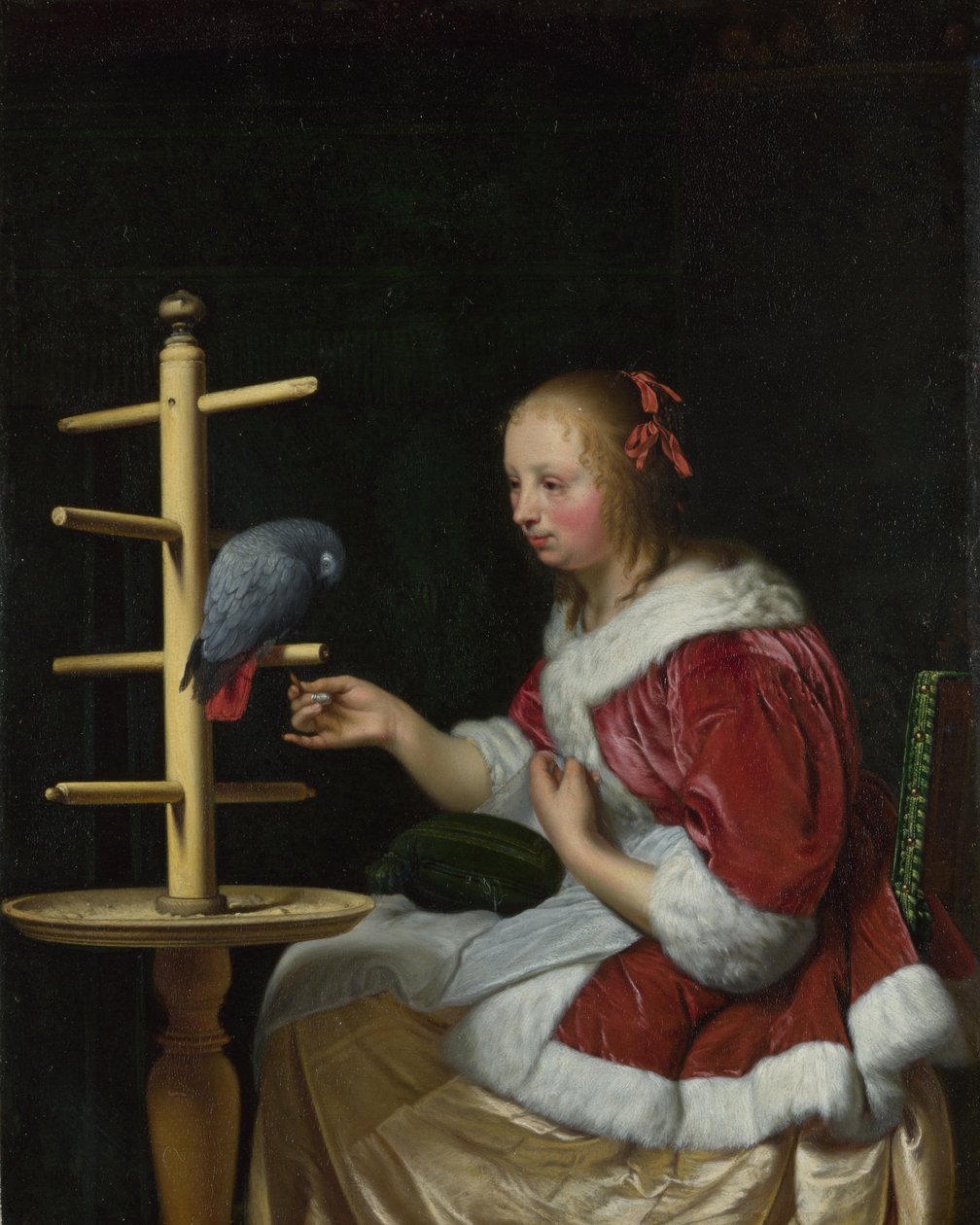 En kvinne i en rød jakke mater en papegøye, ca 1663 av Frans van Mieris the Elder
