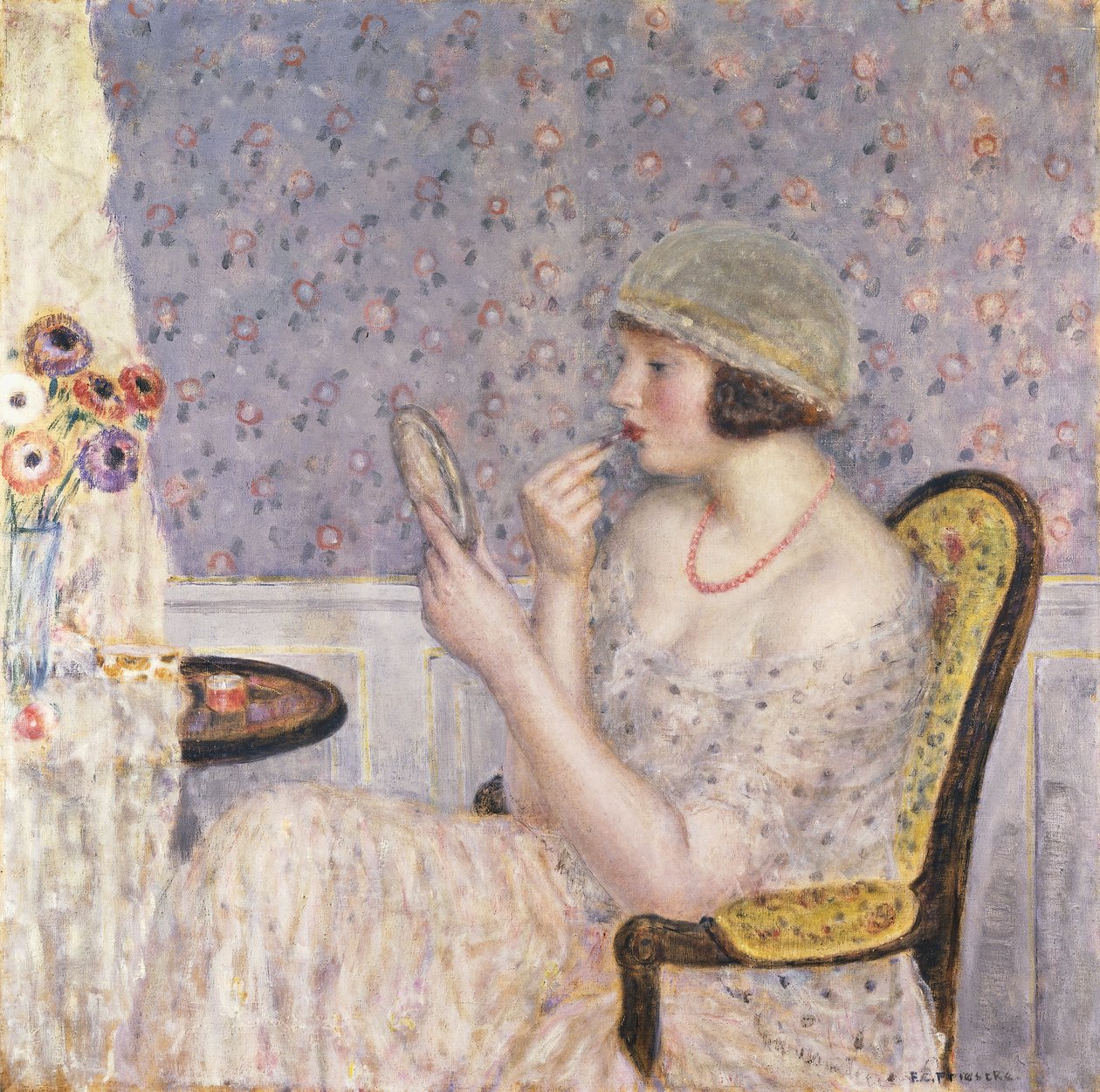 Kvinne ved et sminkebord av Frederick Carl Frieseke