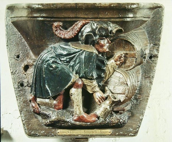 Misericord fra en korstall som viser en mann som tester vin, fra kirken Saint-Etienne des Tonneliers, Rouen (polykromt tre) av French School