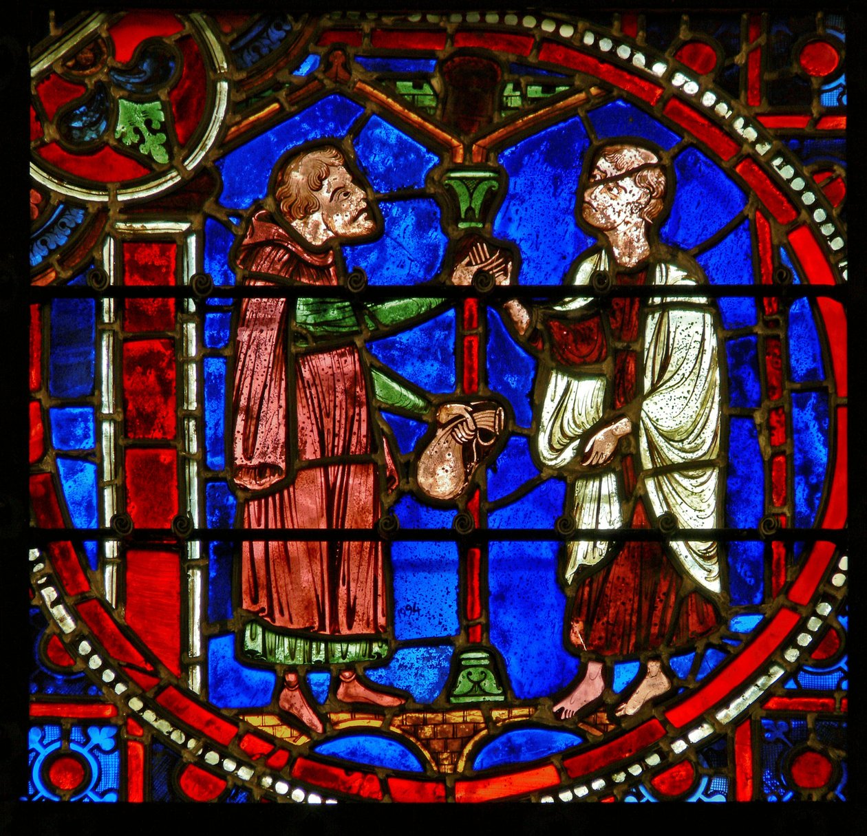 Detalj fra et vindu som viser scener fra miraklet til Theophilus av French School