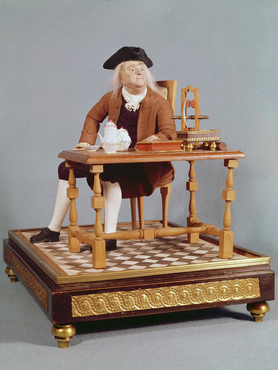 Modell av Benjamin Franklin (1706-90) ved bordet hans, sent på 1700-tallet av French School