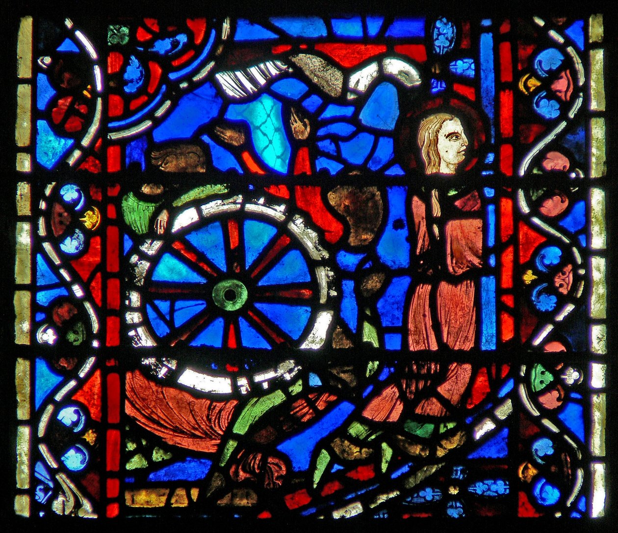 Vindu w53 som viser en scene fra St. Catherines liv: torturistene forbereder hjulet for prøvelsen hennes. av French School