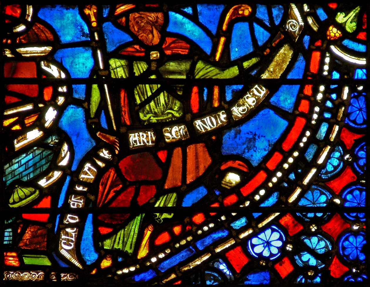 Vindu w9 som viser farao som holder en banderole med ordene I Clement of Chartres laget dette vinduet (i Joseph-vinduet) av French School