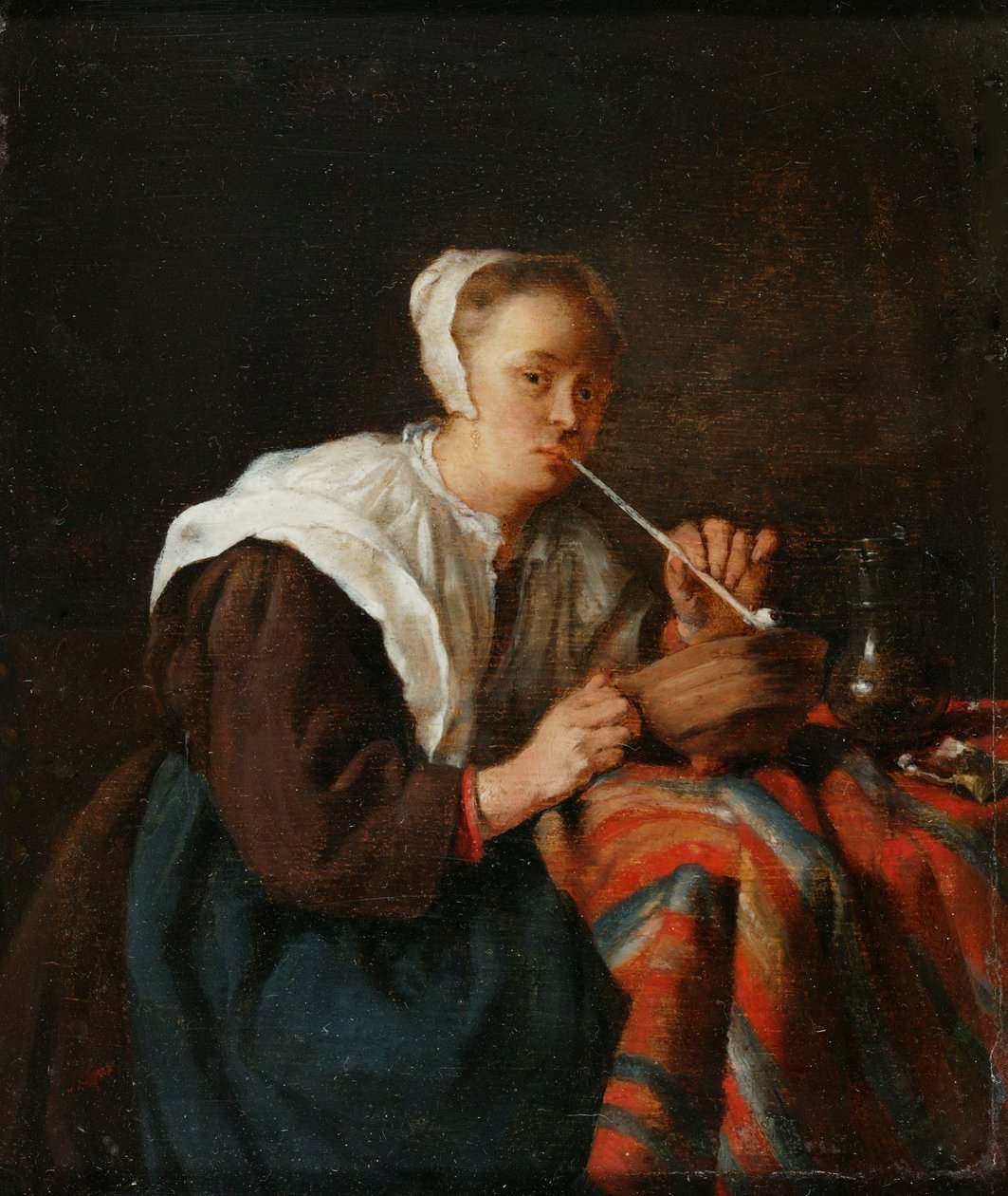 En kvinne som sitter og røyker pipe (olje på panel) av Gabriel (after) Metsu