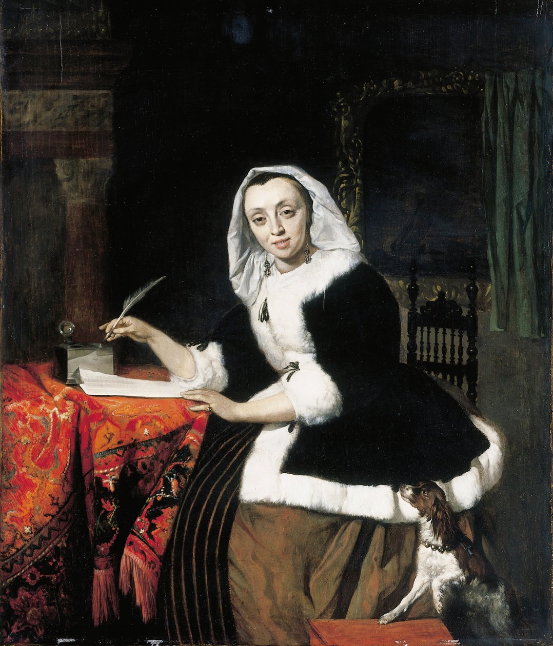 En elegant dame som skriver ved skrivebordet hennes, med en hund ved siden av seg av Gabriel Metsu