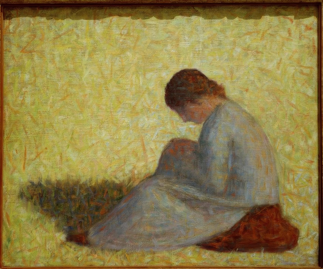 Bondekvinne sitter i gresset av Georges Seurat