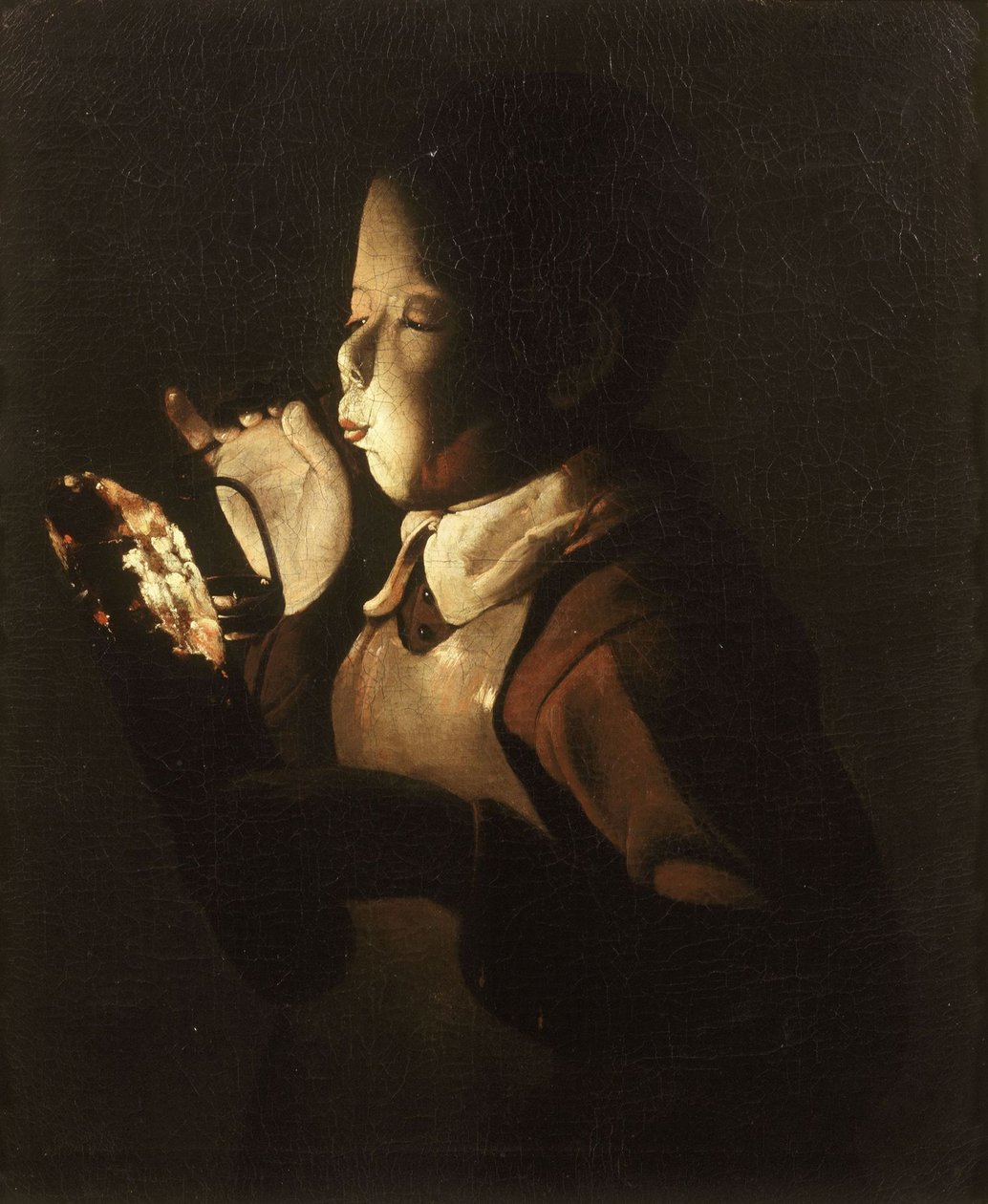 Gutt som blåser på lampen av Georges de La Tour