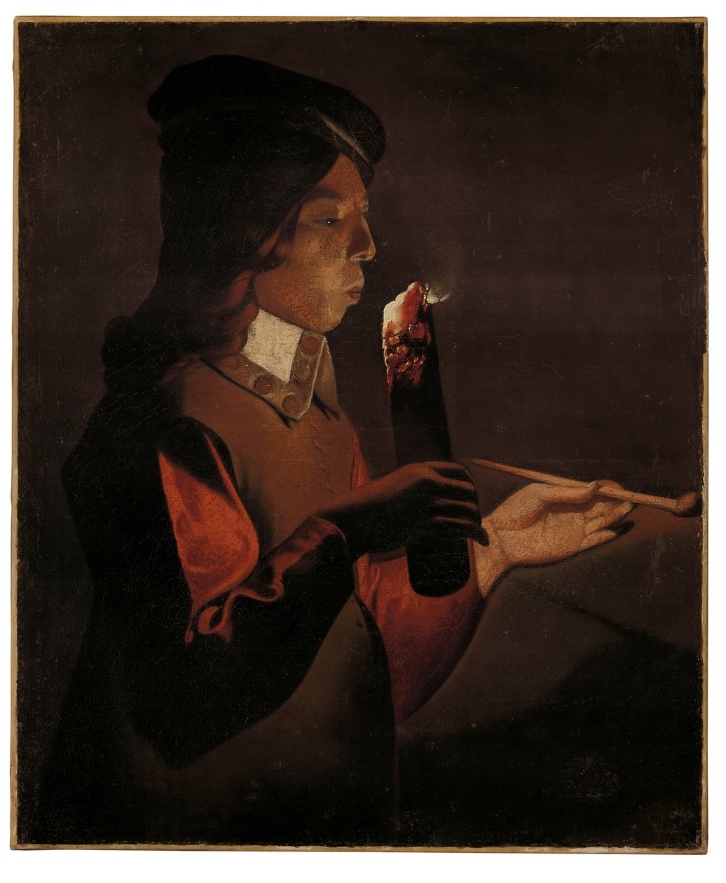En ung gutt med en pipe, som blåser på et ildsted (olje på lerret) av Georges de La Tour
