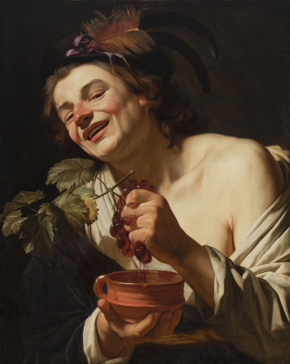 Smilende ung mann som klemmer druer, 1622 av Gerrit van Honthorst