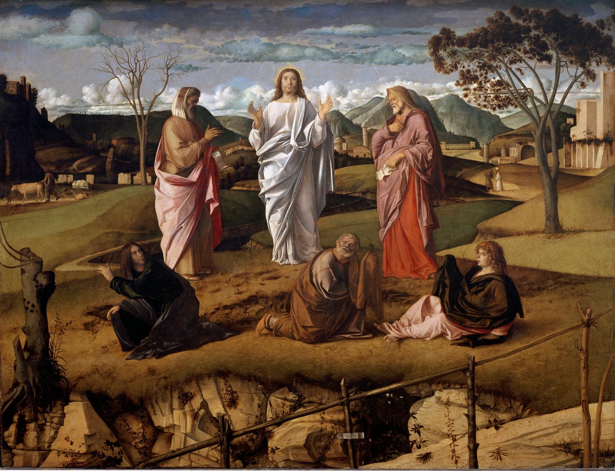Kristi forvandling. Karakterene til Moses og Elias i Det gamle testamente er representert rundt Jesus. Kunstnerens signatur er representert på et papir som holder avslutningen i forgrunnen. Maleri av Giovanni Bellini sa il Giambellino (1432 av Giovanni Bellini