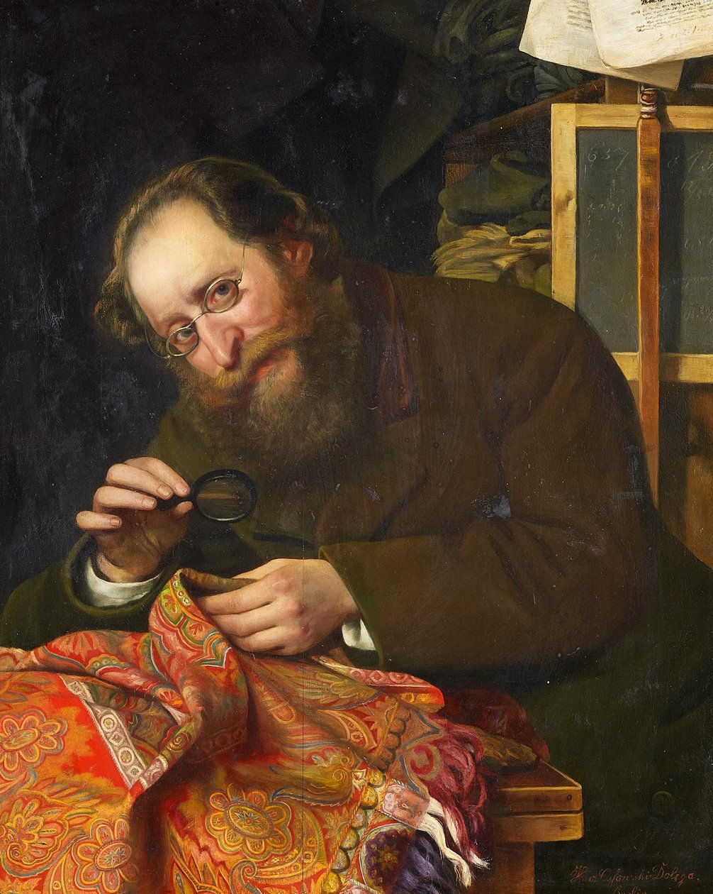 Portrett av en skjeggete herre som studerer et veggteppe med forstørrelsesglass av H. von Ossowski Dolega
