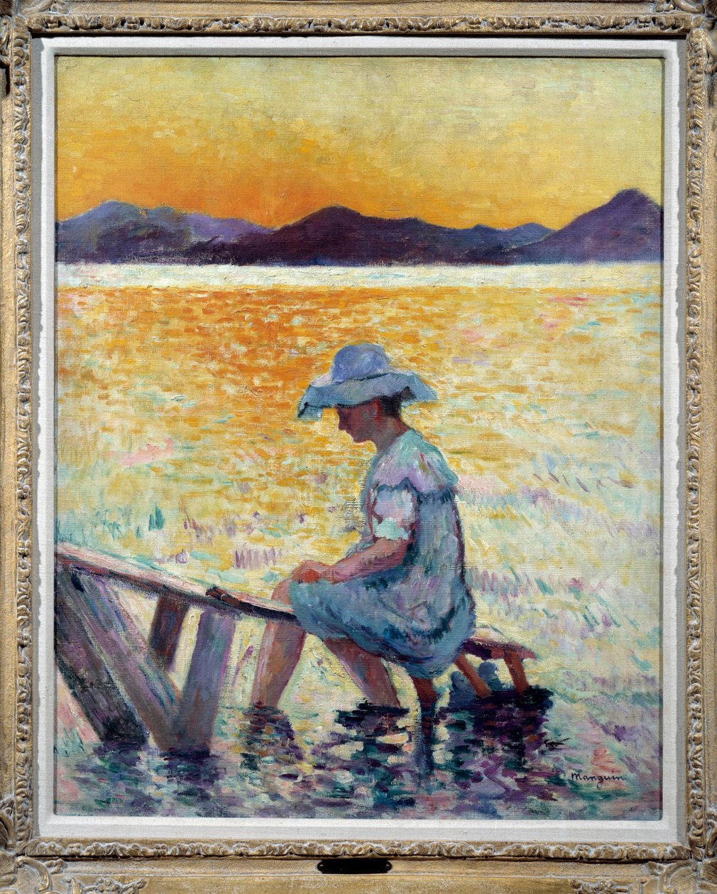 Saint Tropez, solnedgang En kvinne som sitter med føttene i vannet på kysten av Henri Charles Manguin