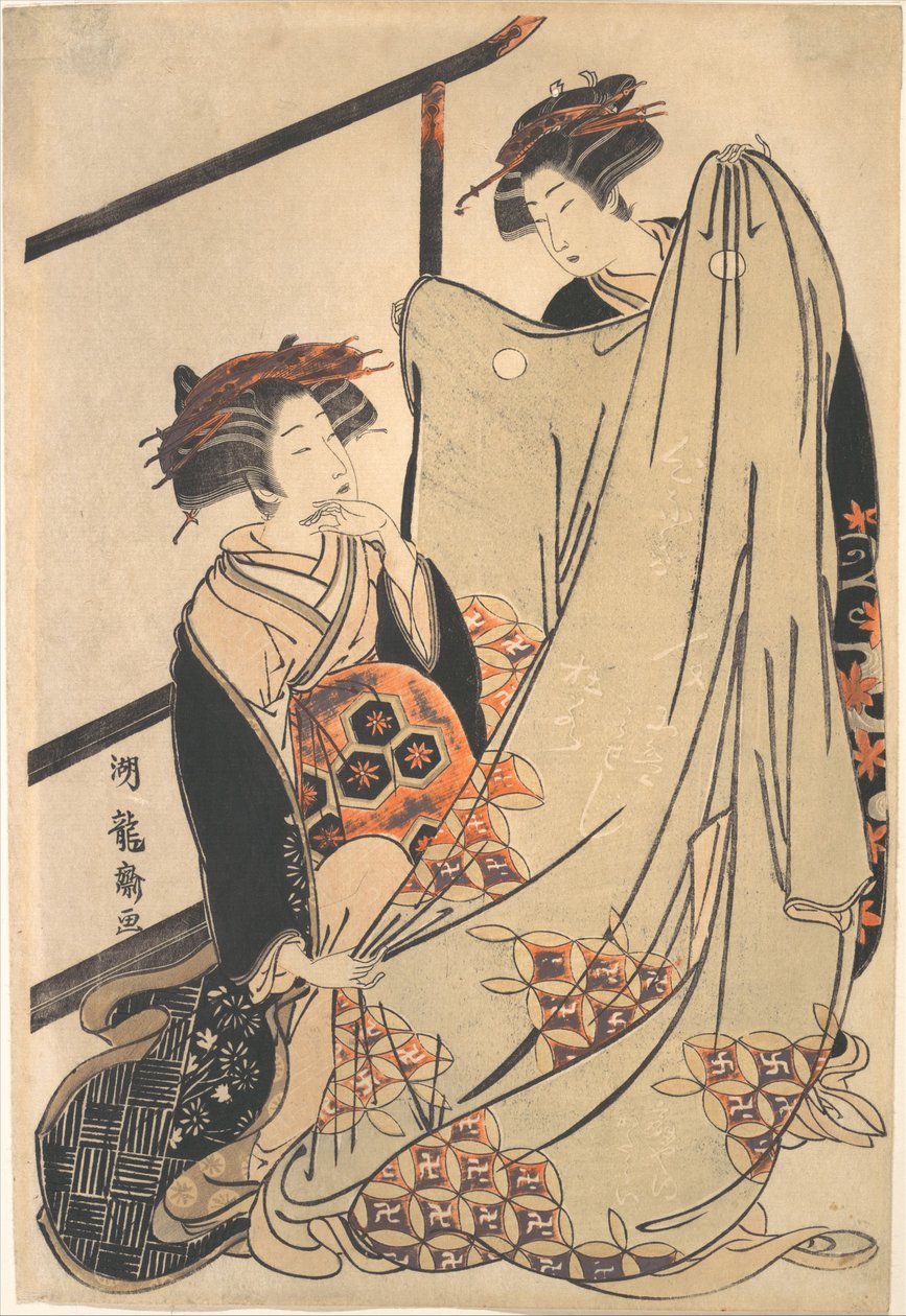 To skjønnheter som ser på en kimono av Isoda Koryusai