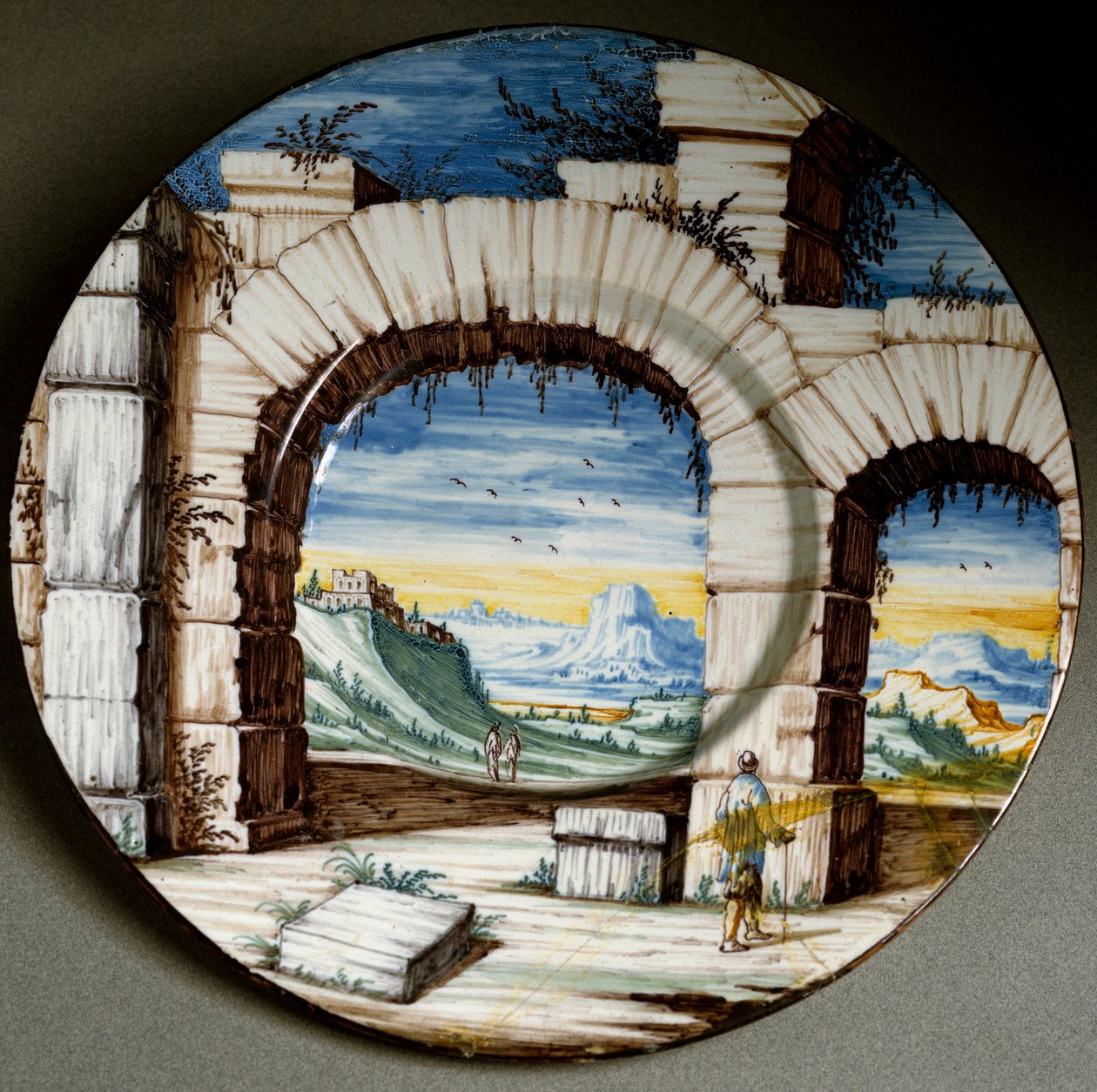 Ruin og landskap. Keramisk plate produsert i Angarano, Italia. Rundt 1650 Firenze, Museo Nazionale del Bargello av Italian School