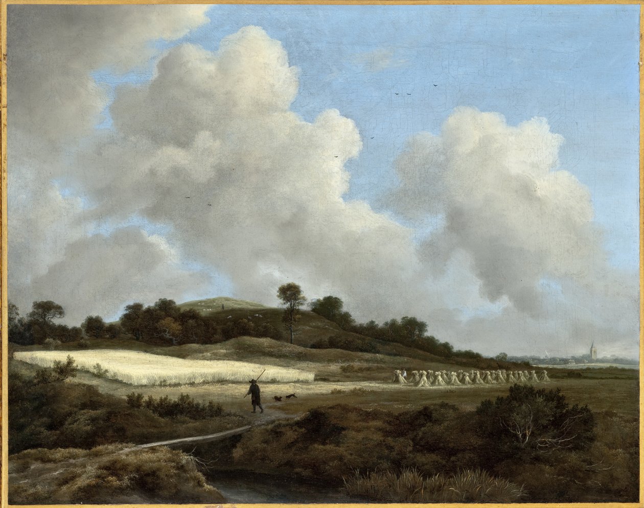 Utsikt over kornåkre med en fjern by av Jacob van Ruisdael