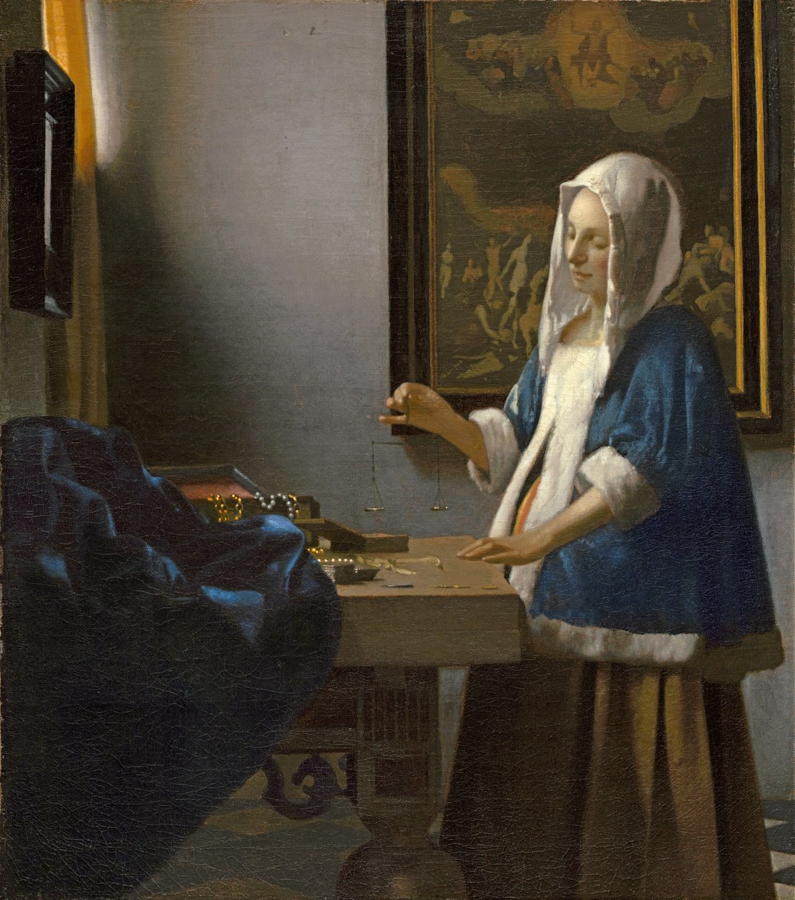 Kvinne holder en balanse av Jan Vermeer van Delft