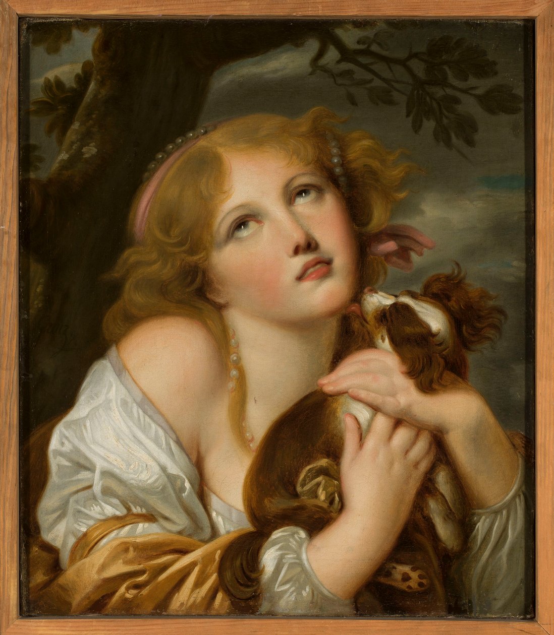 Jente med en hund i armene av Jean-Baptiste Greuze