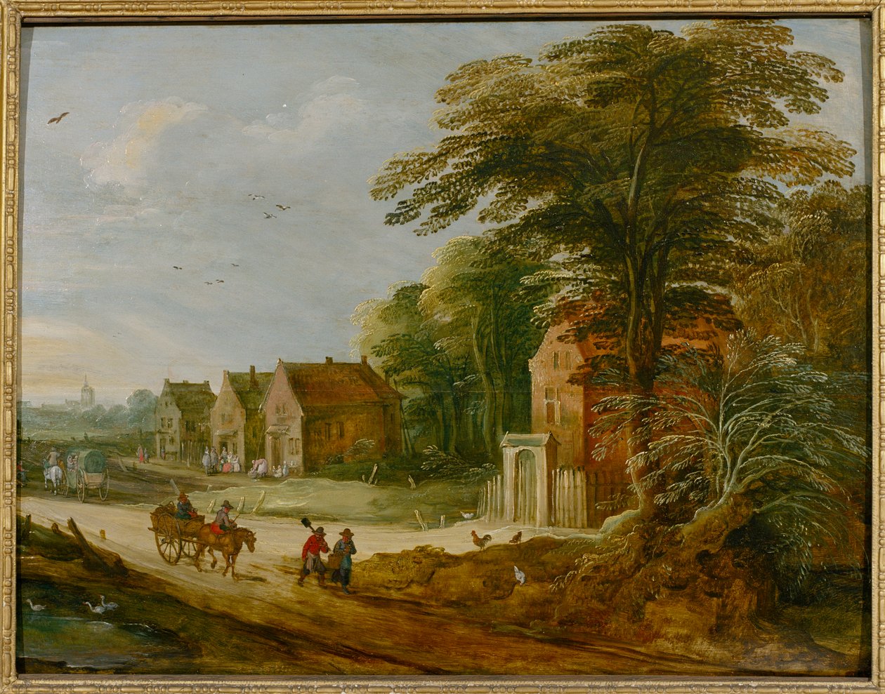 Reisende som passerer gjennom en landsby (olje på panel) av Joos de (studio of) Momper
