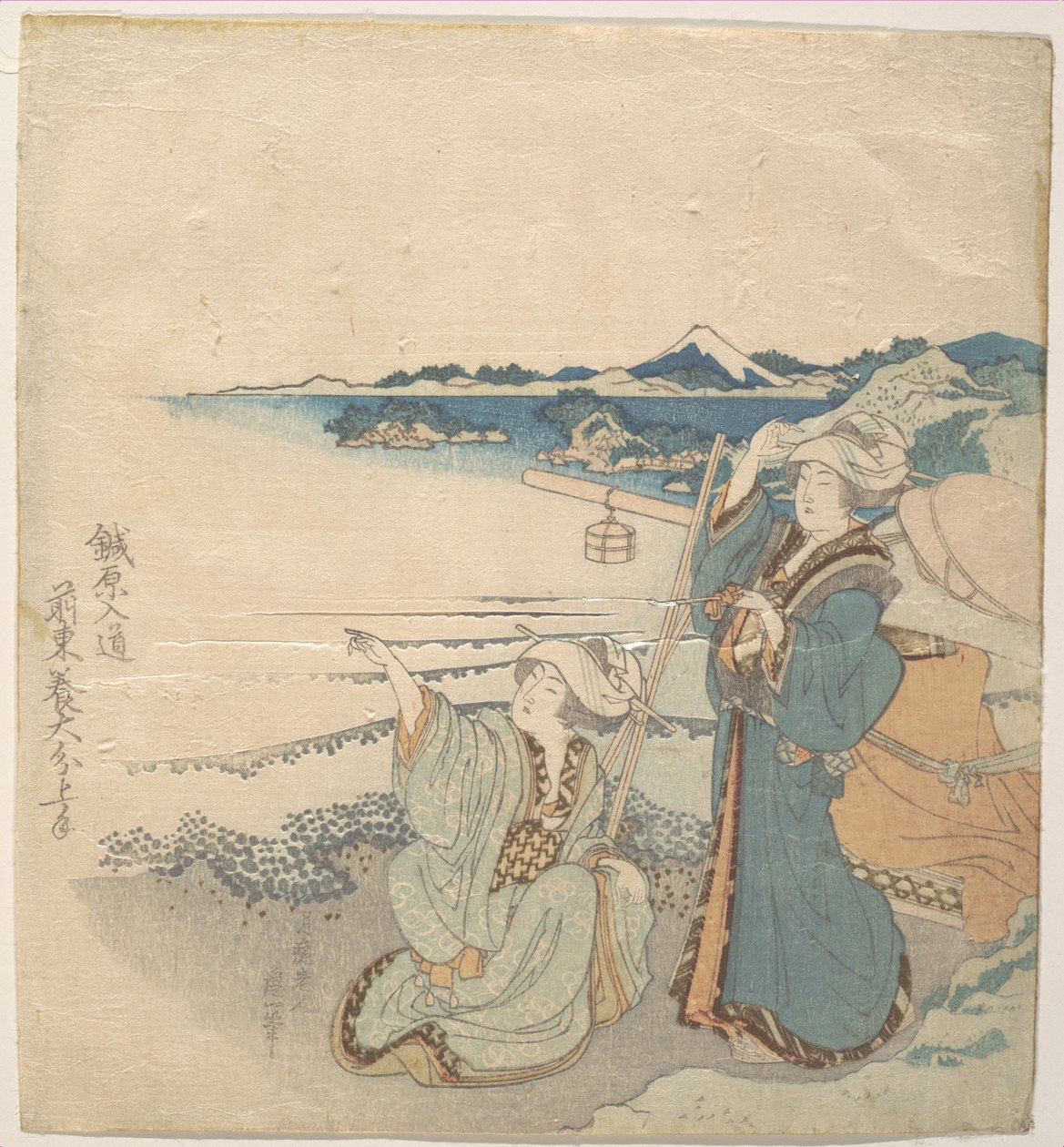 To unge damer ved stranden; den ene peker av Katsushika Hokusai