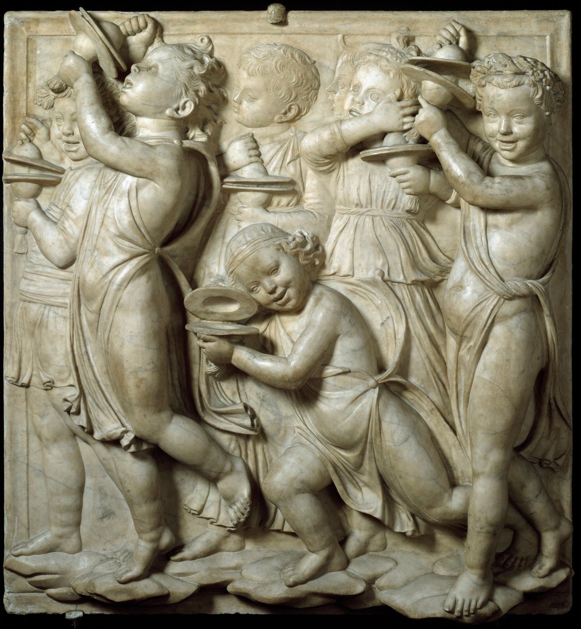 Panel av Cantoria eller tribune av sangere: barn som spiller cymbaler. høymarmorrelieff av Luca della Robbia (ca. 1400-1482) 1431-1438 Dim. 348 cm Museo dell