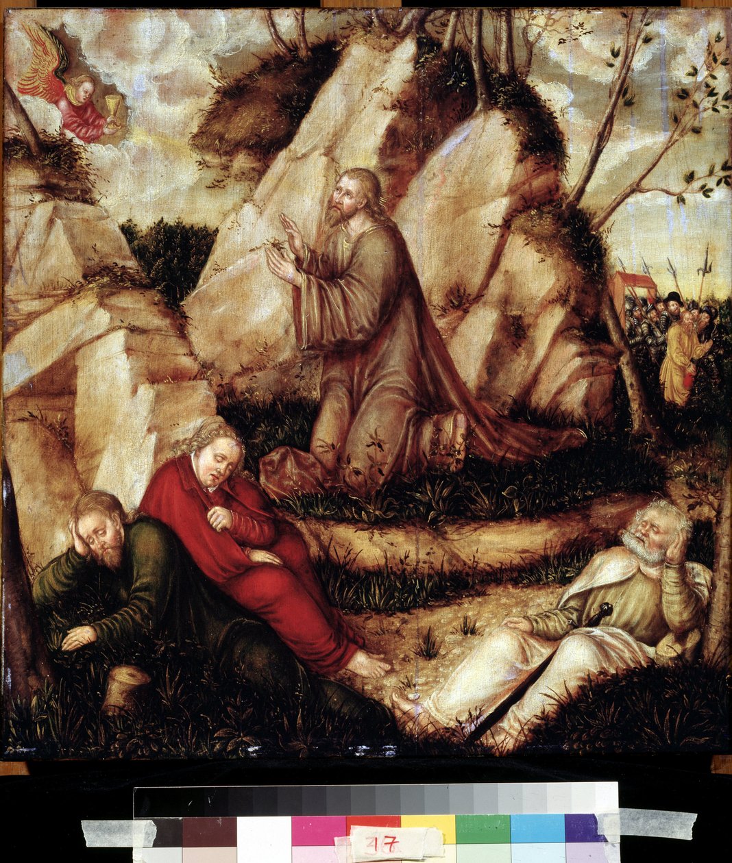 ""Bønn i olivenhagen"" (Kval i hagen) Etter det siste måltidet går Kristus til Getsemane-høyden som dominerer Jerusalem sammen med apostlene. De romerske soldatene hjelper Judas nærmer seg for å arrestere ham. Maling på tre fra L av Lucas the Elder Cranach