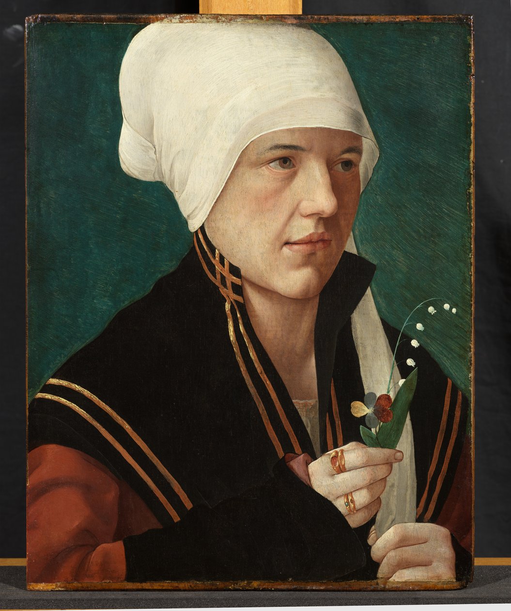 Portrett av en kvinne som holder en liljekonvall og en stemorsblomst, 1510-20 av Marx Reichlich