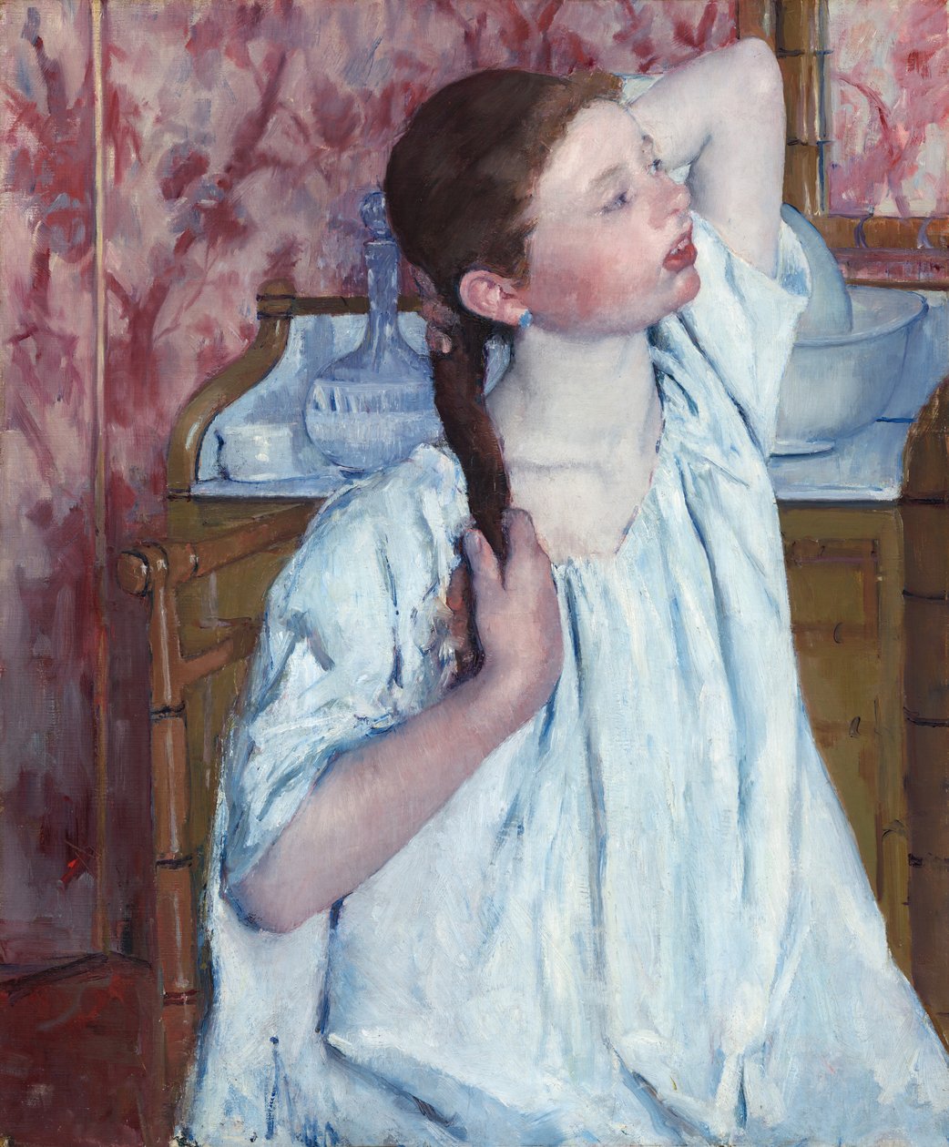 Jente som ordner håret sitt, 1886. av Mary Cassatt