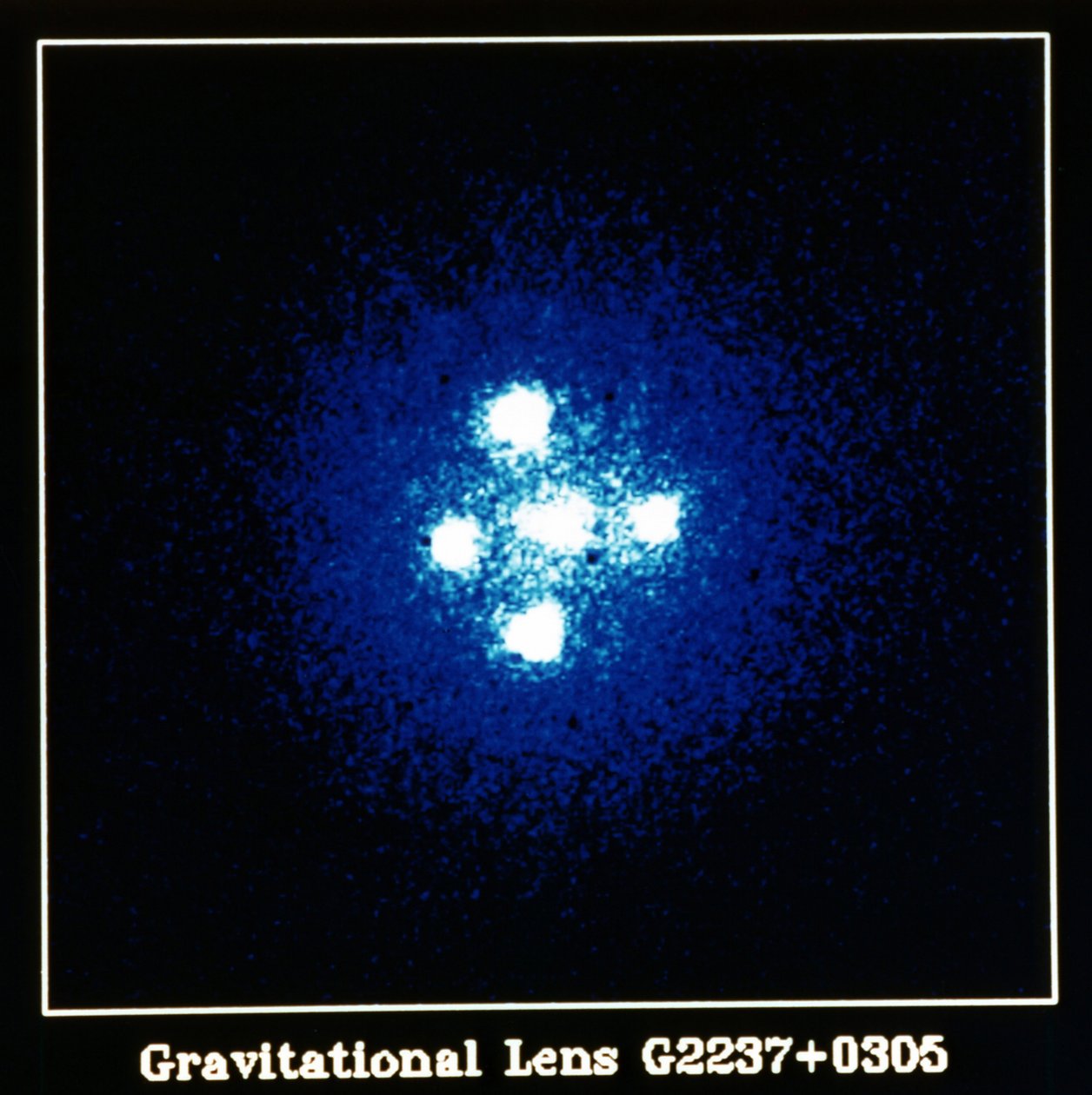 Einstein Cross Quasar: Gravitation Lens G2237 pluss 0305. NASA-fotografi. av National Aeronautics and Space Administration National Aeronautics and Space Administration